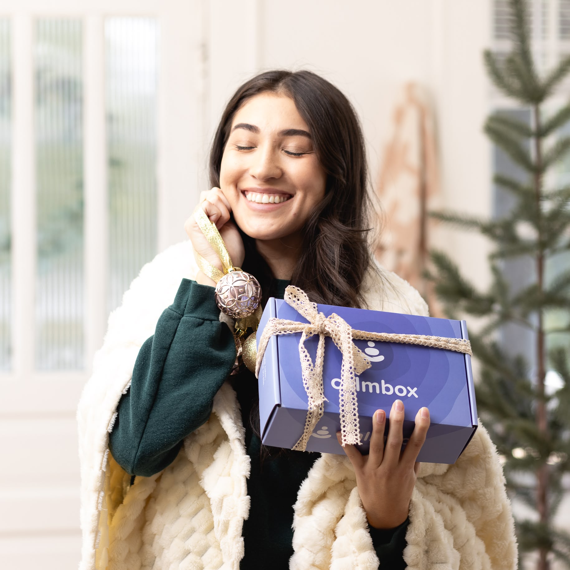 a happy woman with a gift box