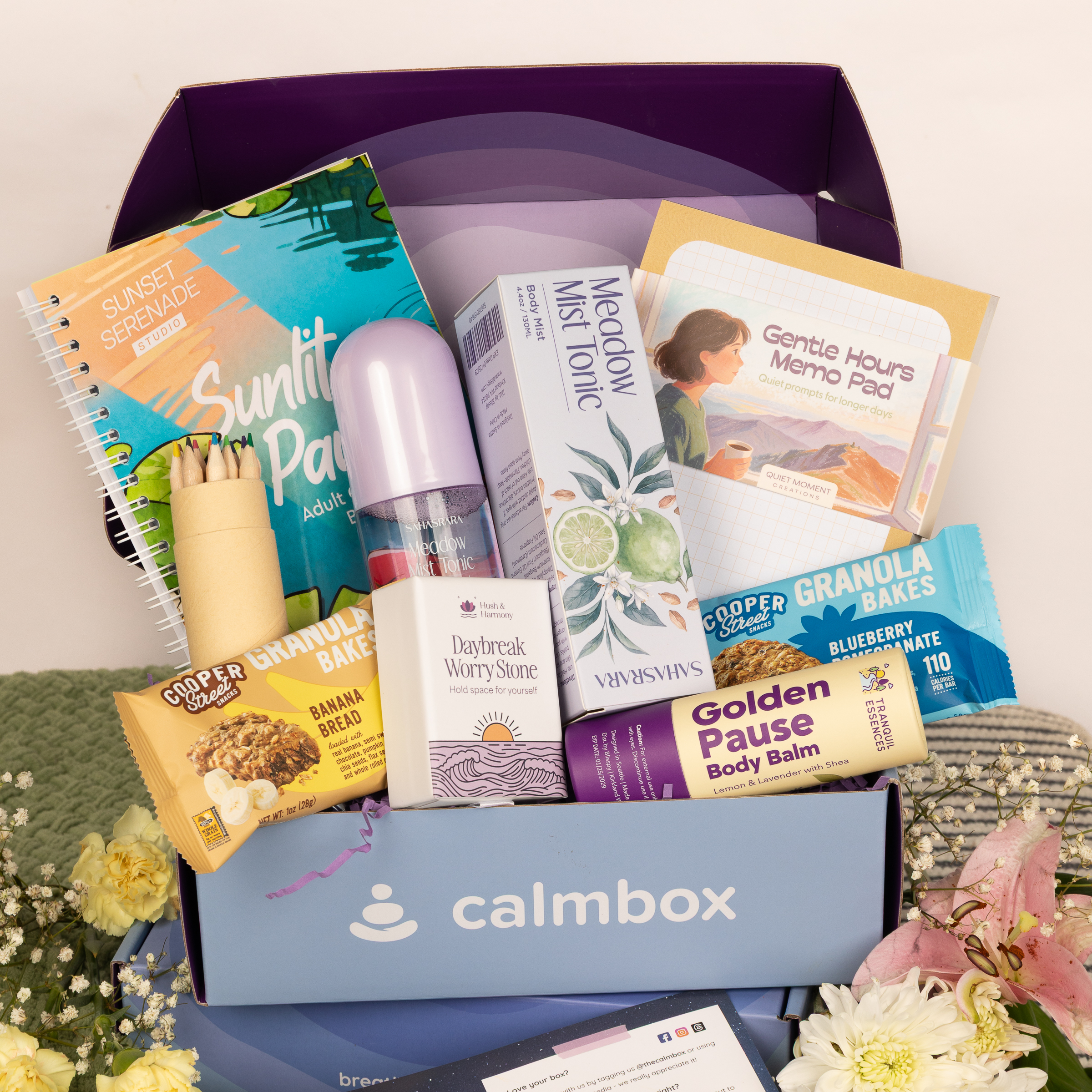 open calmbox with calming items and flowers