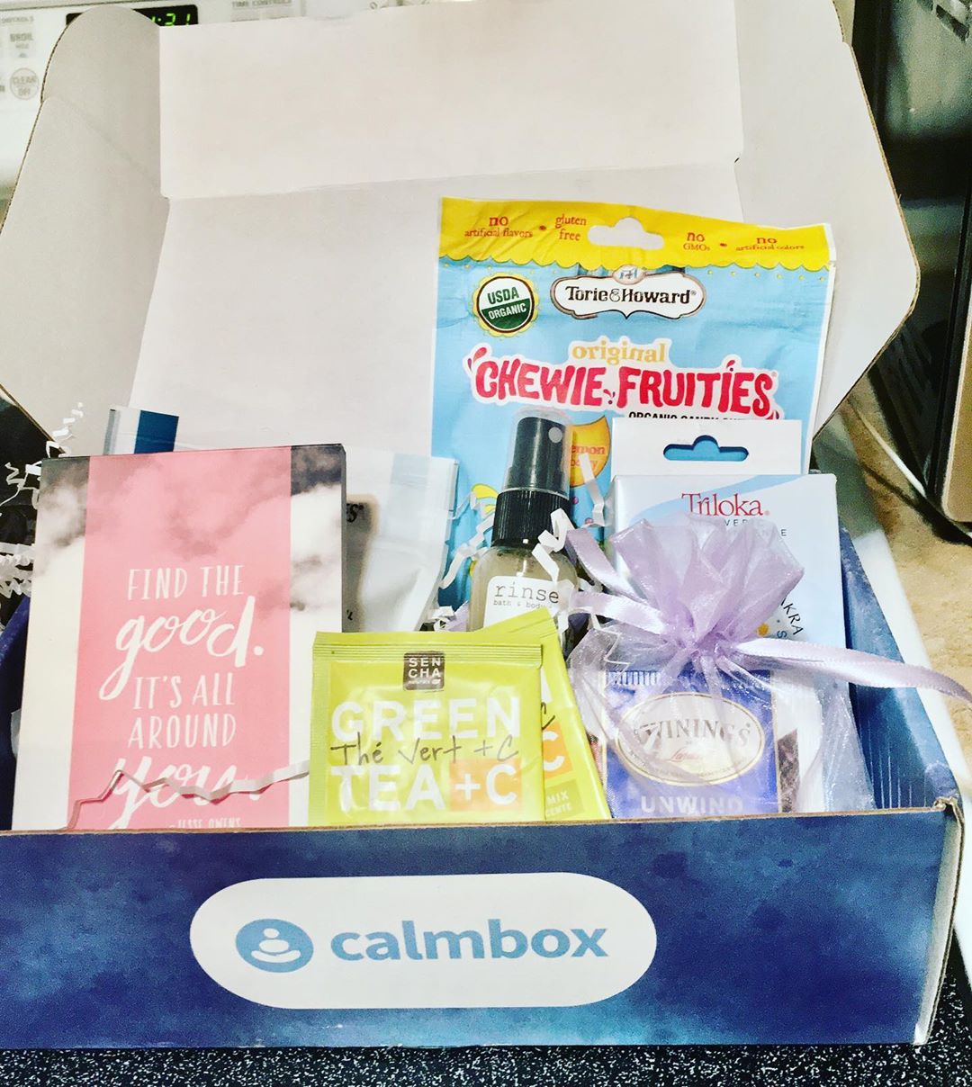 a photo of an open calmbox with items inside